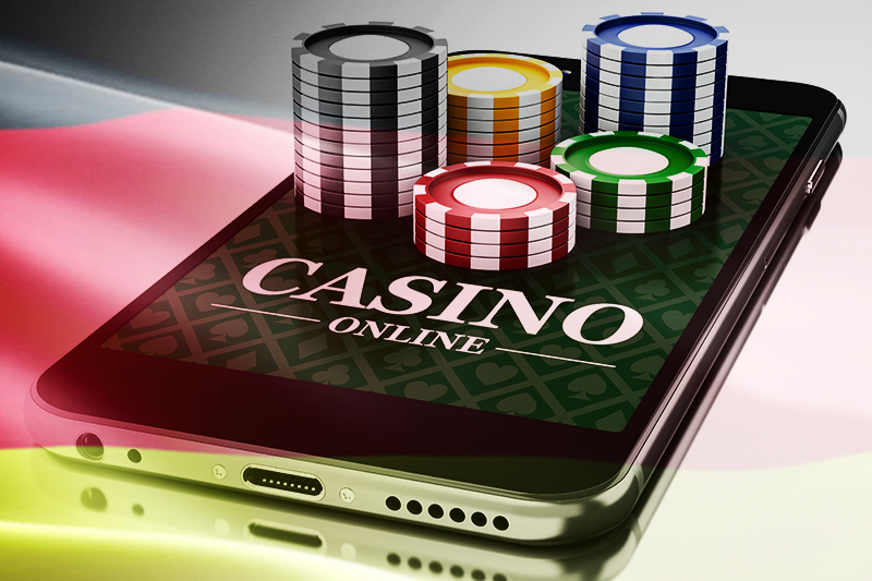 online casino gambling article featured image black color phone with casino chips and casino tokens